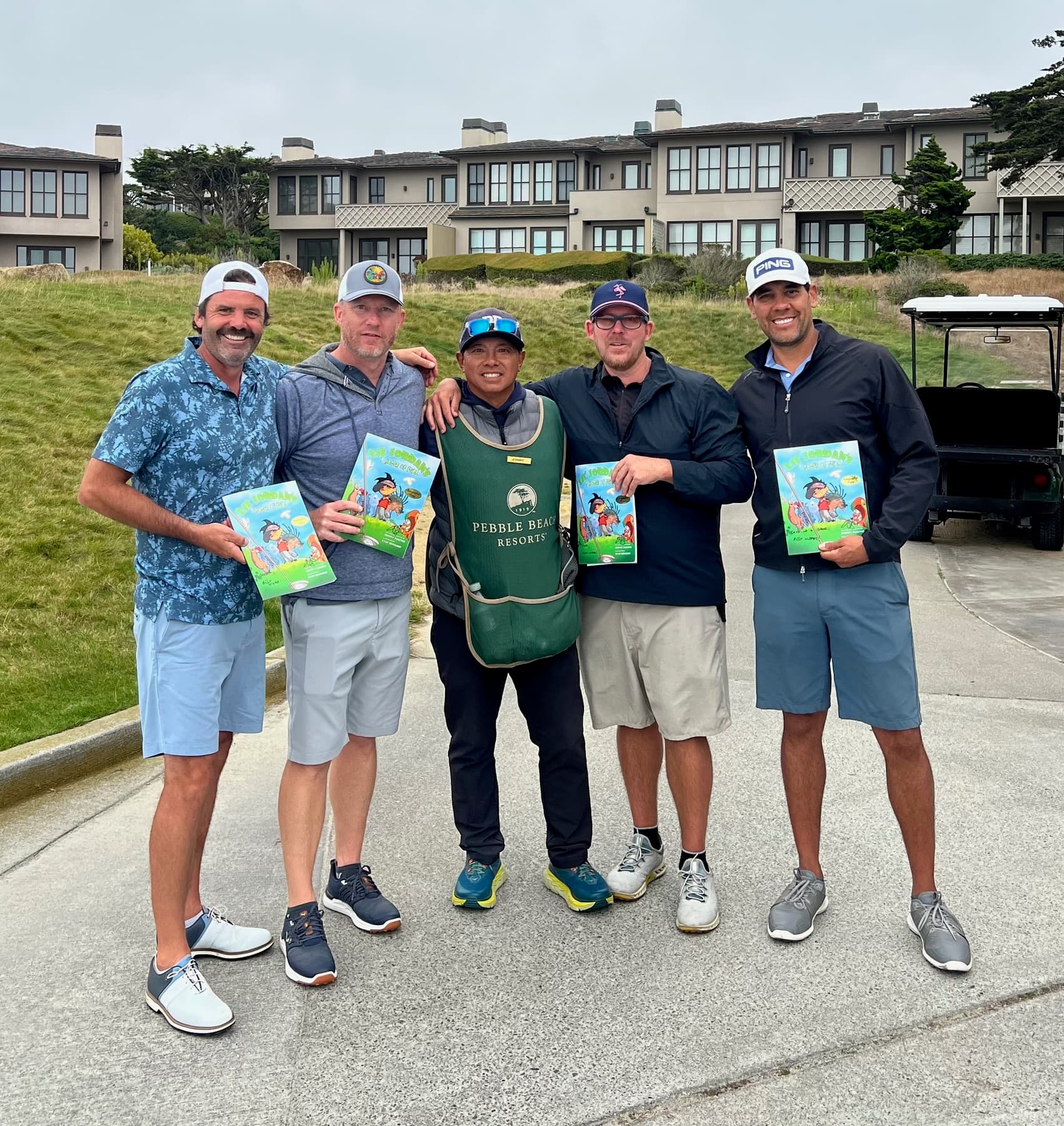 Johnny and four golfers each holding the book