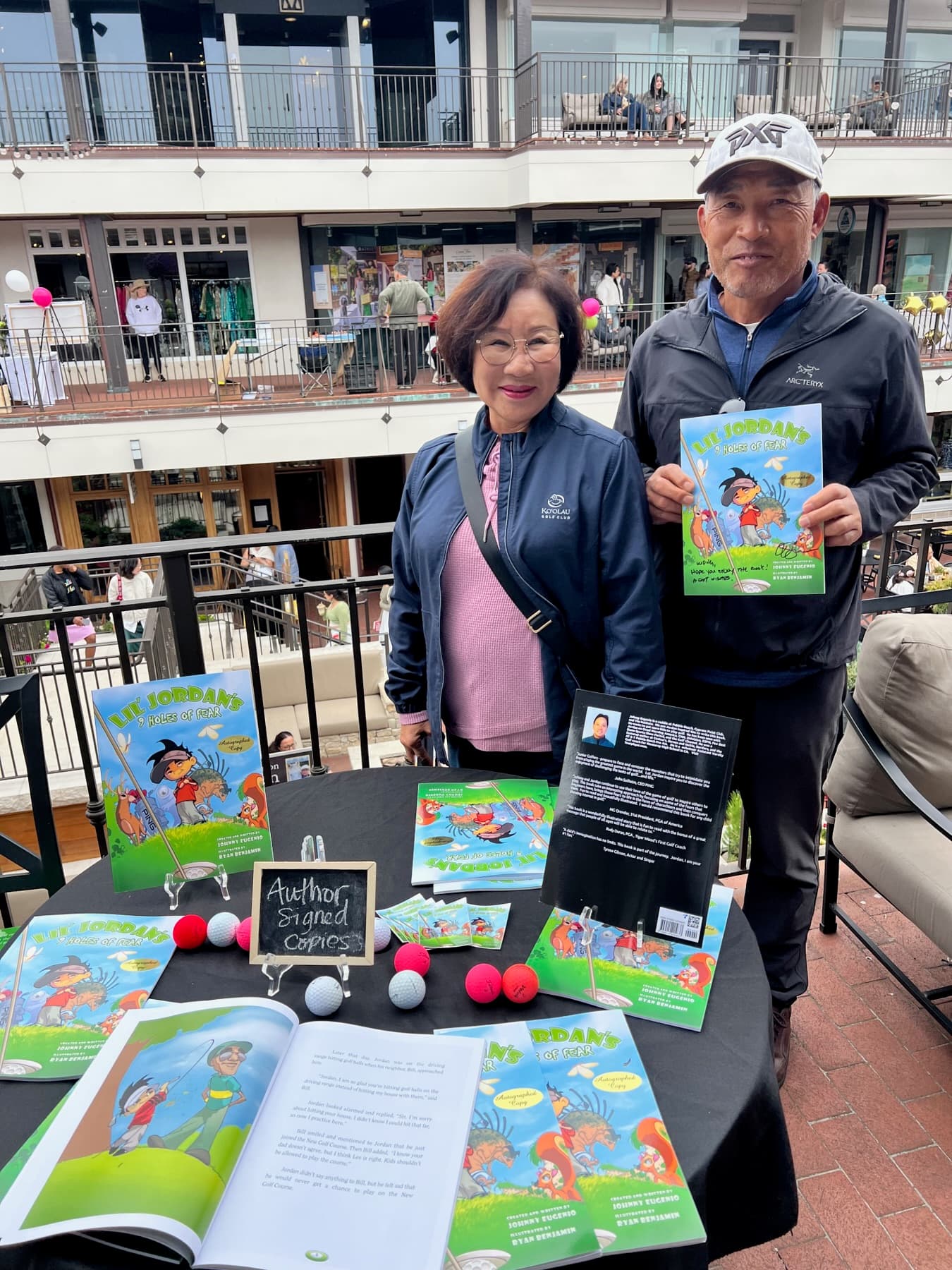 A table of signed copies of Lil' Jordan's 9 Holes of Fear
